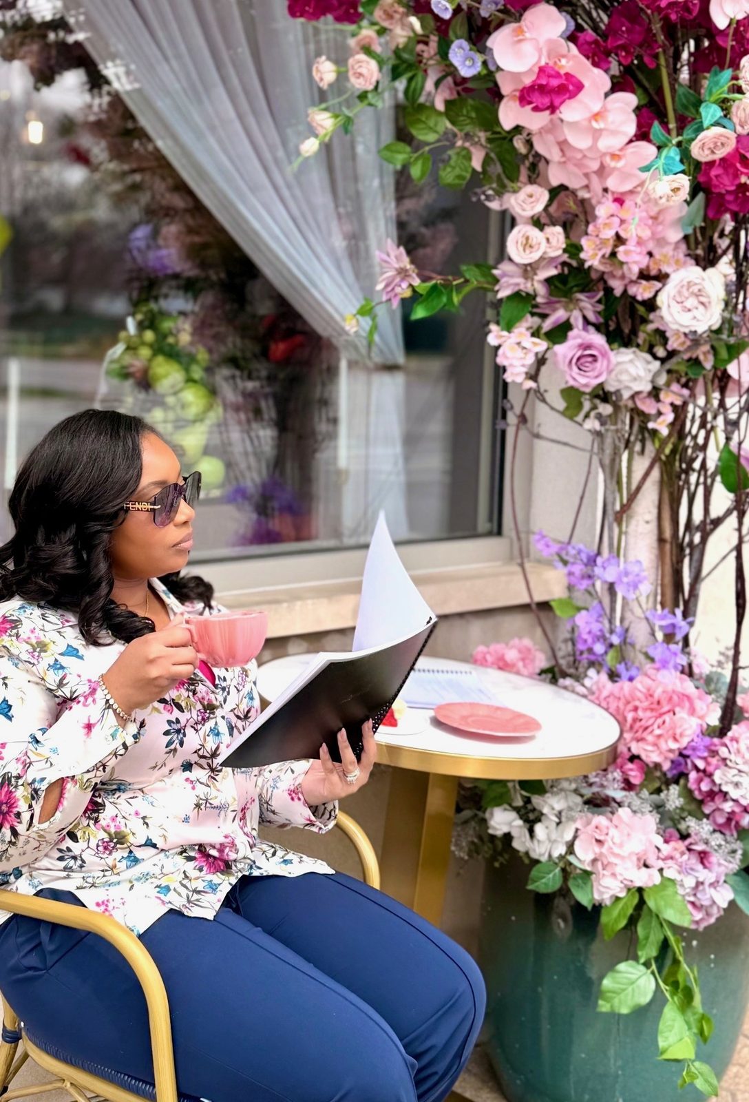 A full afternoon tea service with tiered trays and fresh florals
