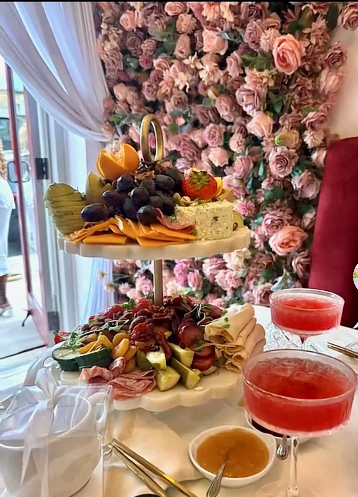 A charcuterie board and tea-infused cocktails set out in The Parlour